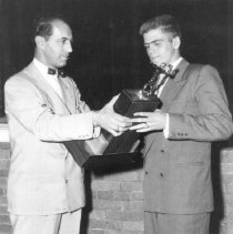 Bill Stade Accepts Varsity Honorary Captain Award at Romeo Football Banquet
